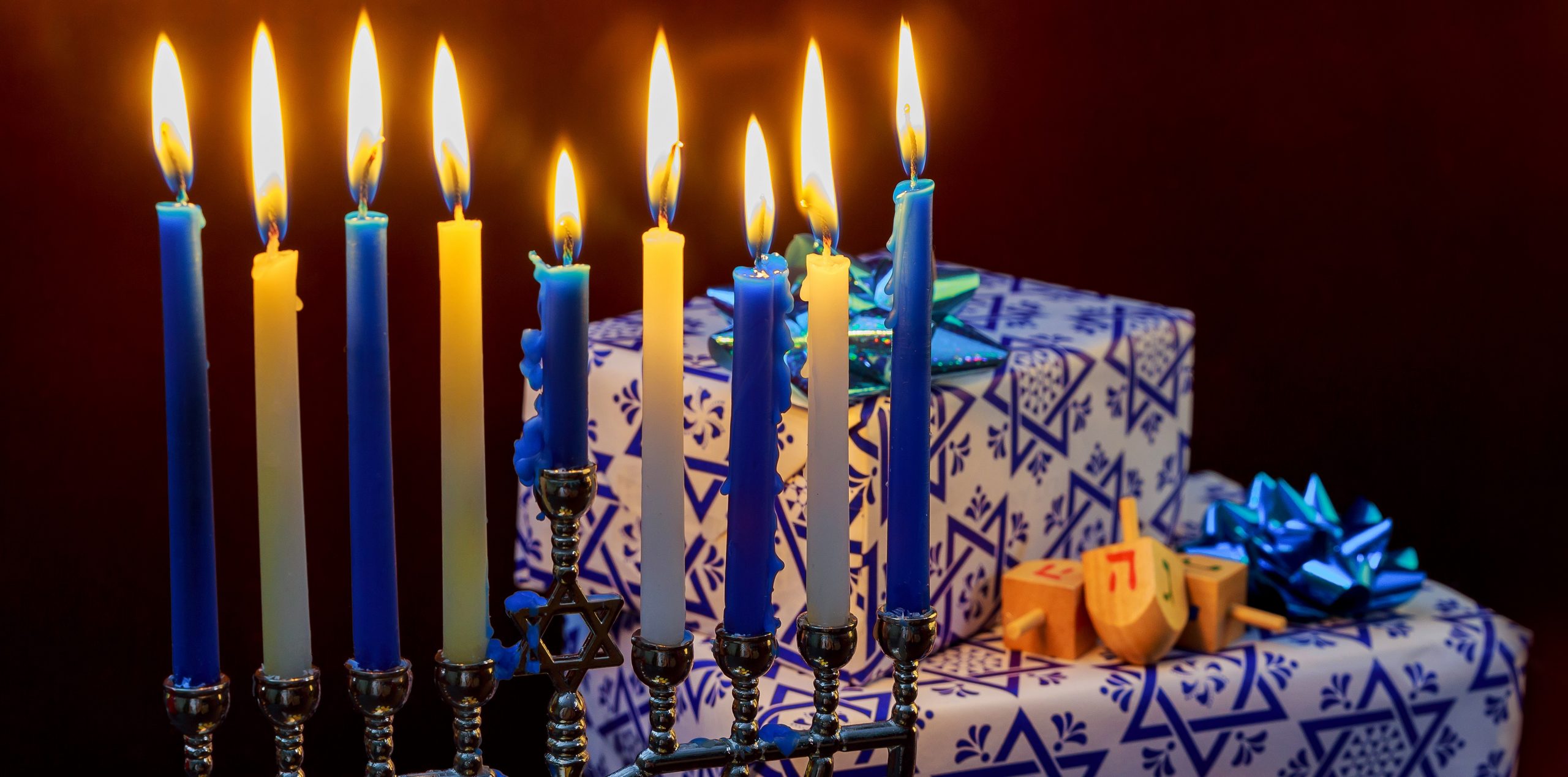 Jewish Holiday Hanukkah holiday with menorah burning candles.