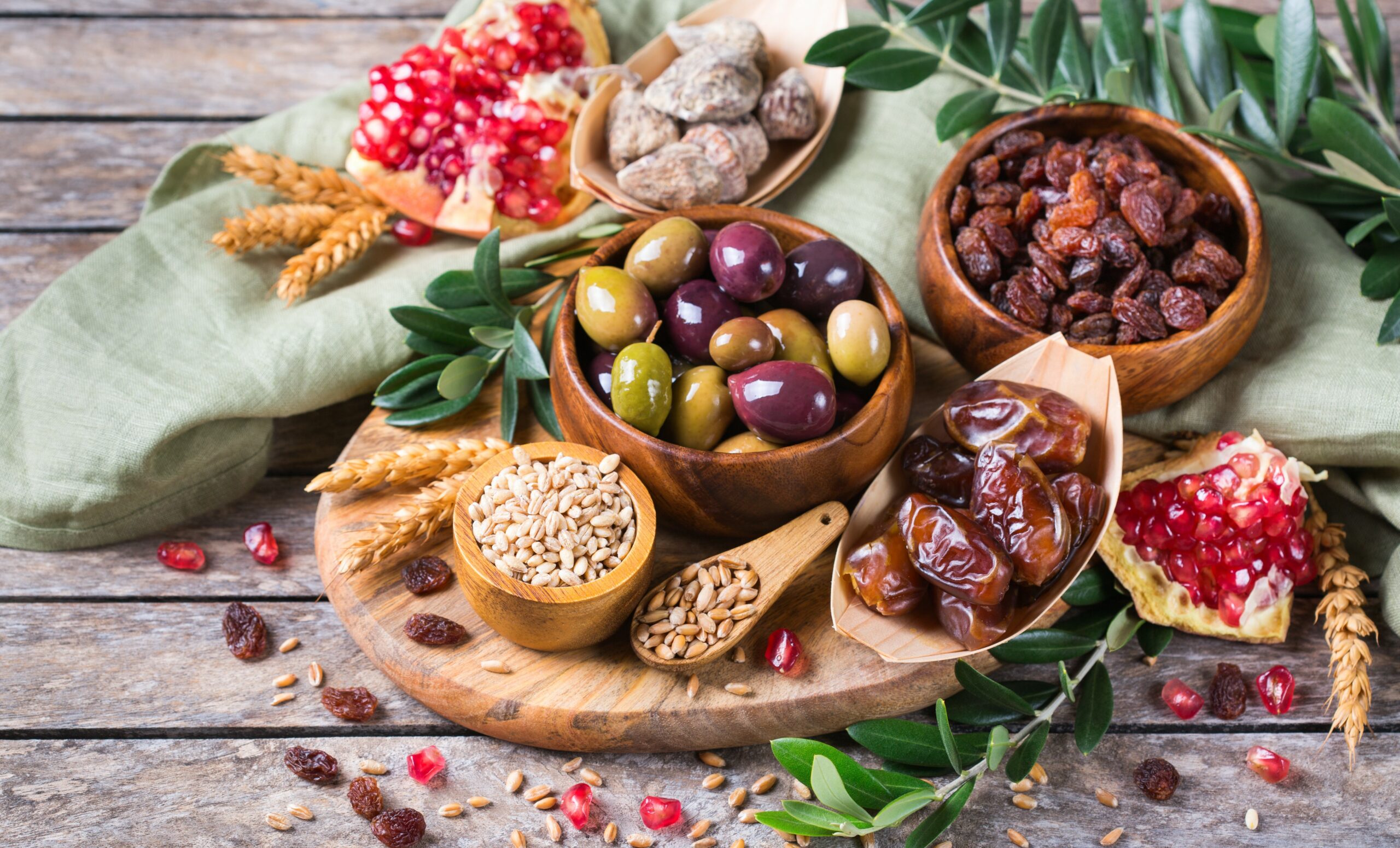 Tu Bishvat holiday symbols - dried fruits, pomegranate, barley, wheat