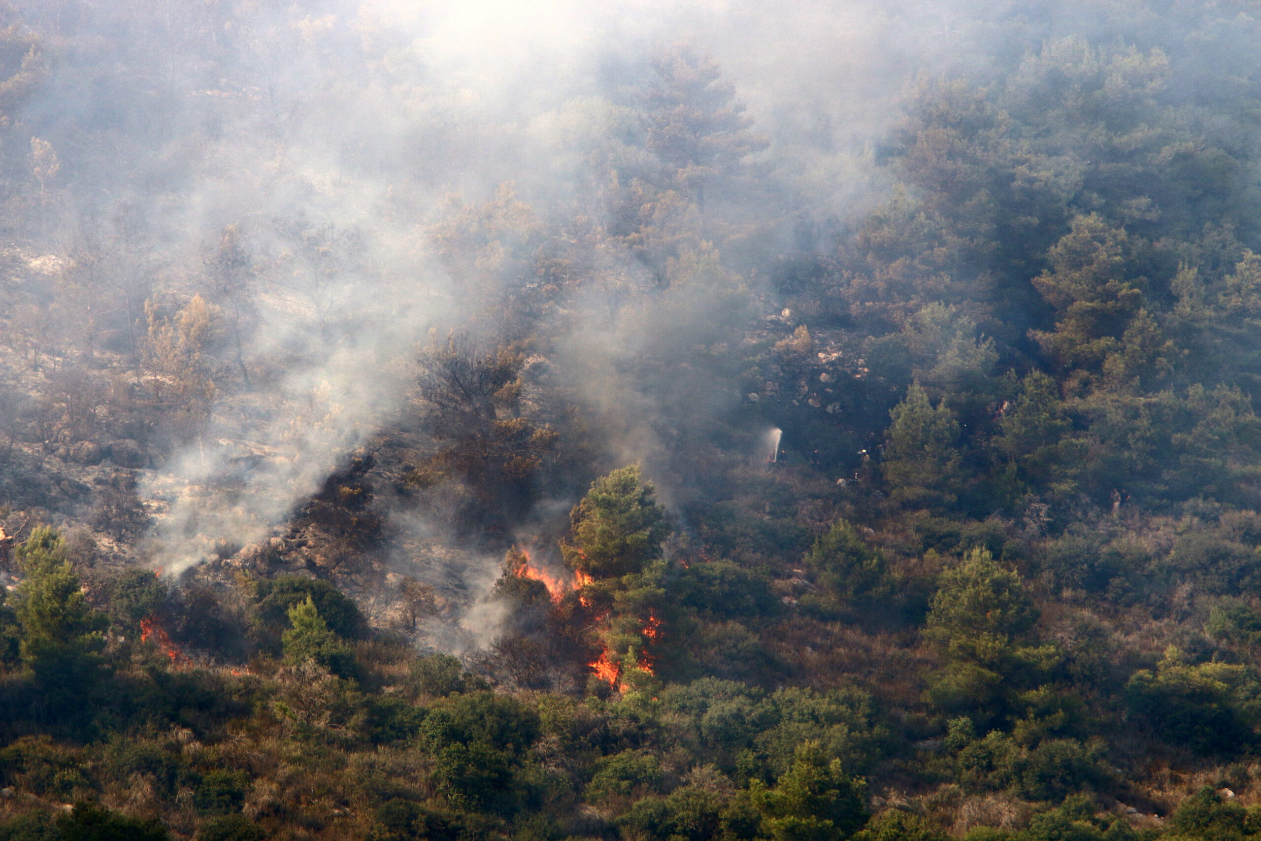 A UN helicopter puts out a fire in a forest on the Israel-Lebanon border.